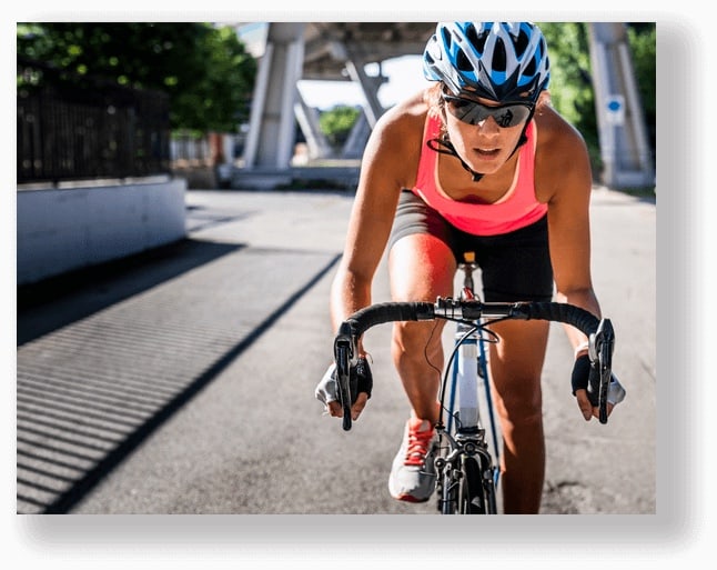 sporty woman rides bicycle